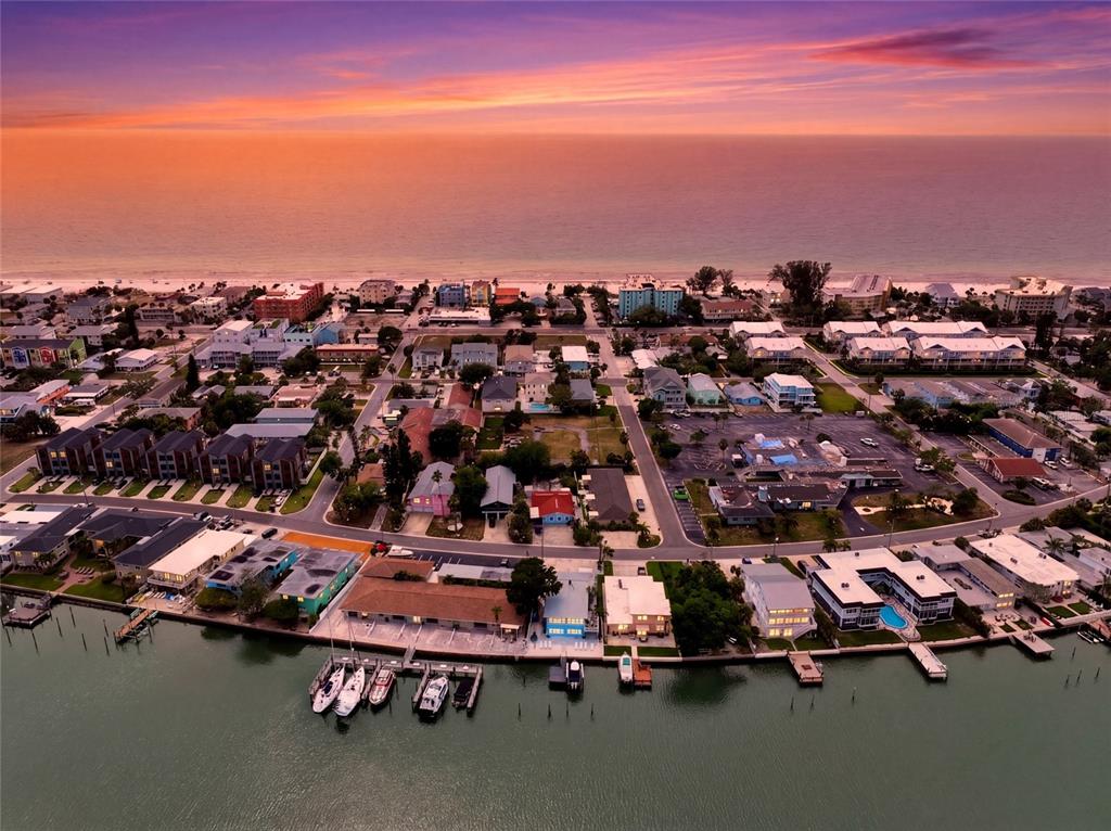2311 Bay Boulevard Indian Rocks Beach, FL 33785 - Photo 75 of 80 an aerial view of a city with lots of residential buildings ocean and mountain view in back
