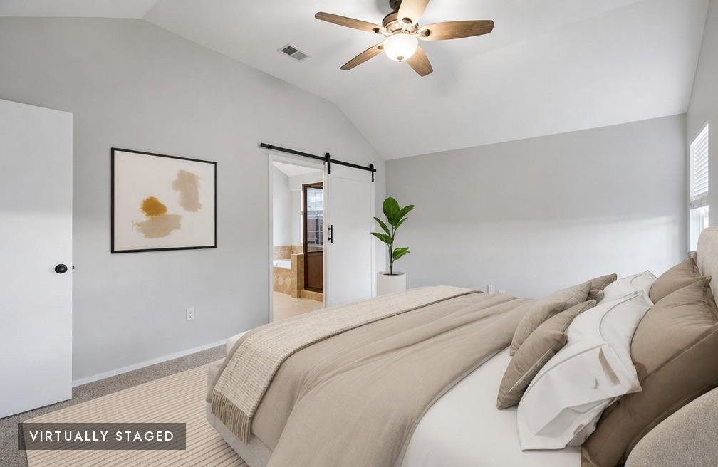 2074 Briarcliff Road Lewisville, TX 75067 - Photo 6 of 40 Vaulted ceiling bedroom with a ceiling fan, light gray walls, and carpet flooring - Virtually Staged
