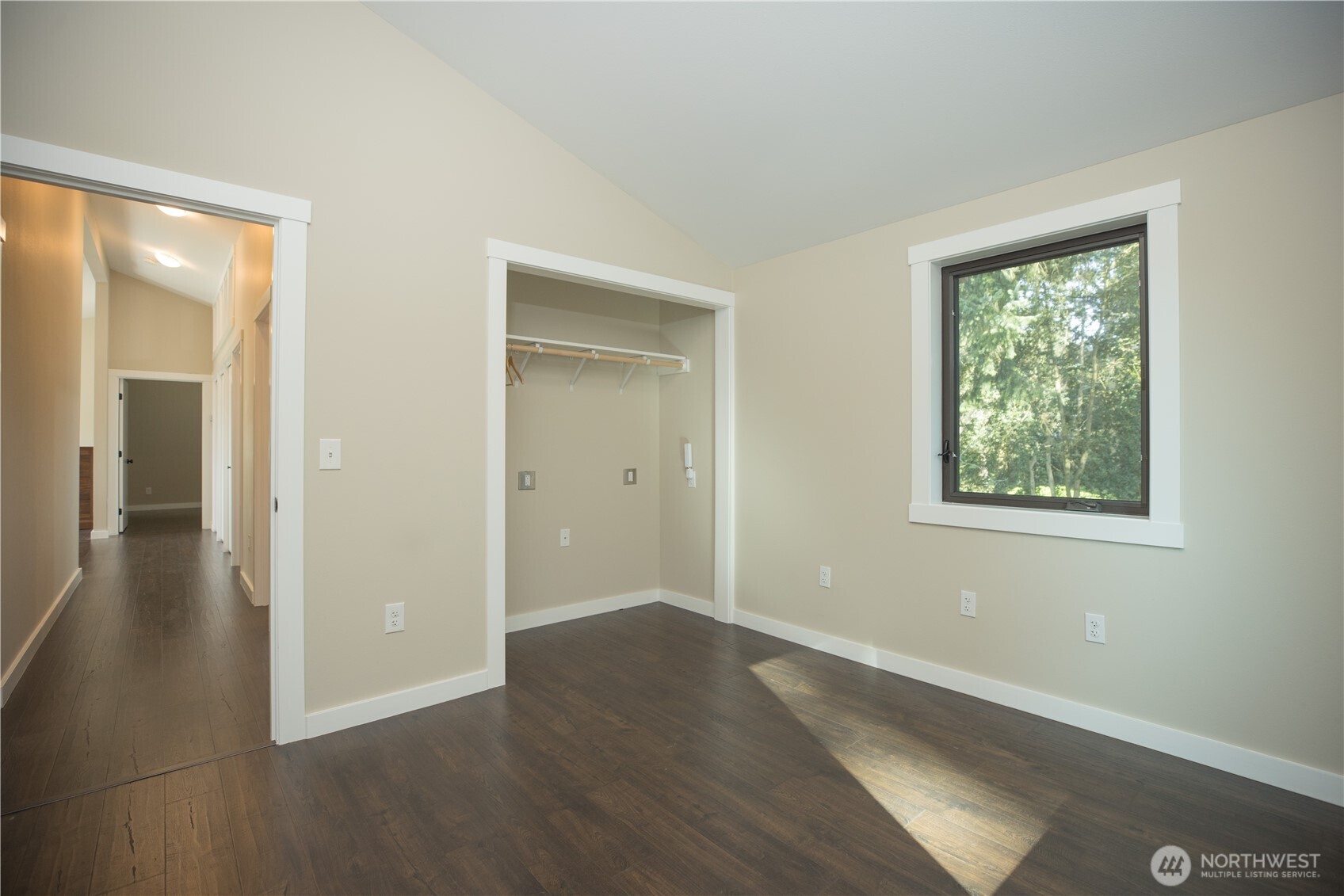 254 Simpson Road Sequim, WA 98382 - Photo 16 of 40 an empty room with wooden floor and windows