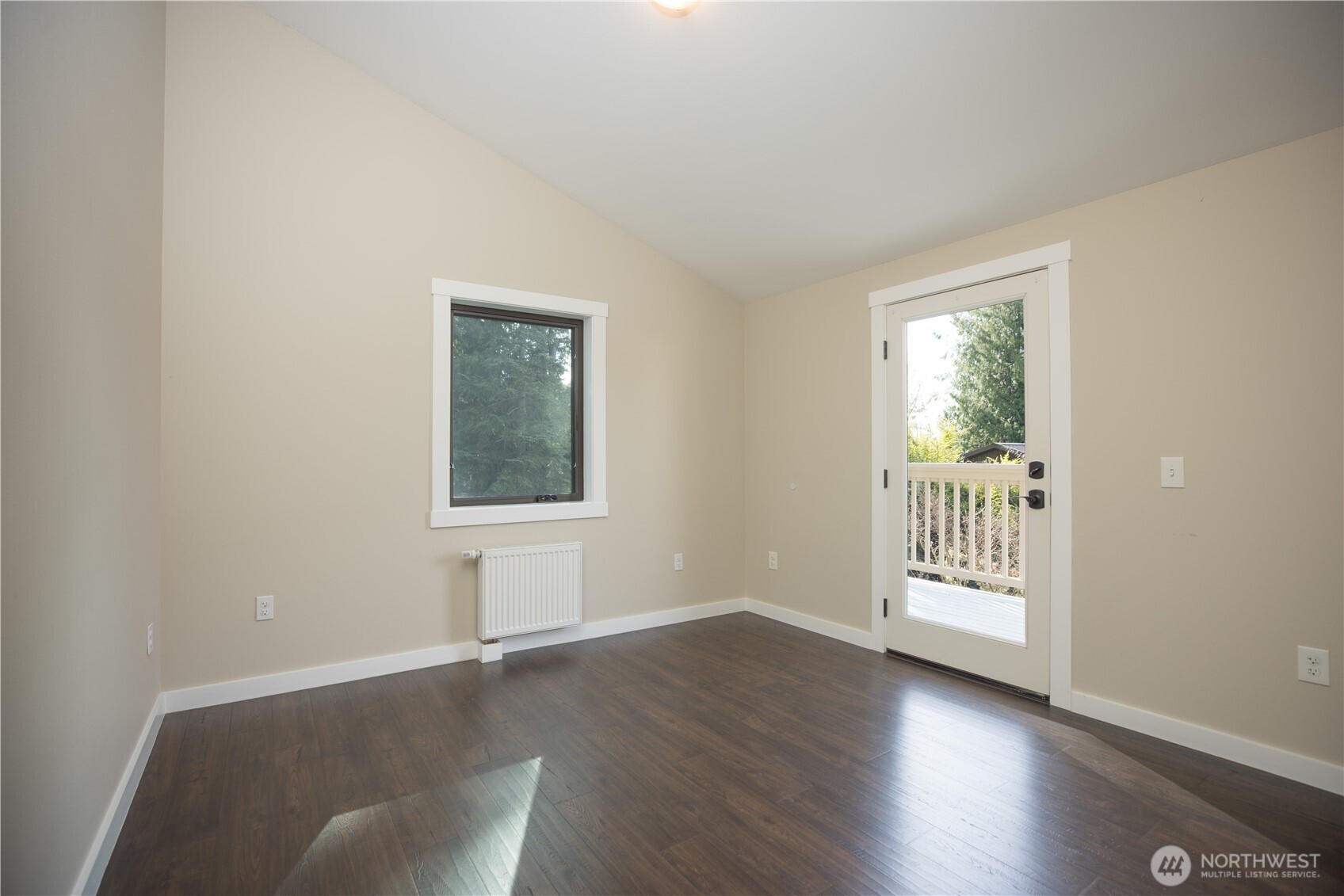 254 Simpson Road Sequim, WA 98382 - Photo 17 of 40 a view of an empty room with wooden floor and a window
