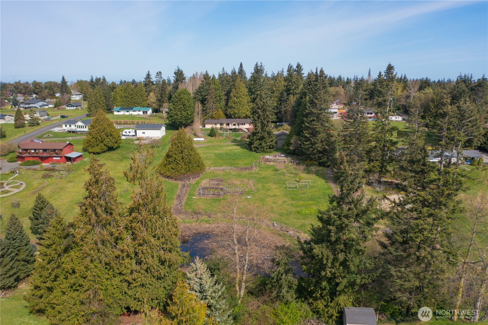 254 Simpson Road Sequim, WA 98382 - Photo 21 of 40 a view of a lake with a yard