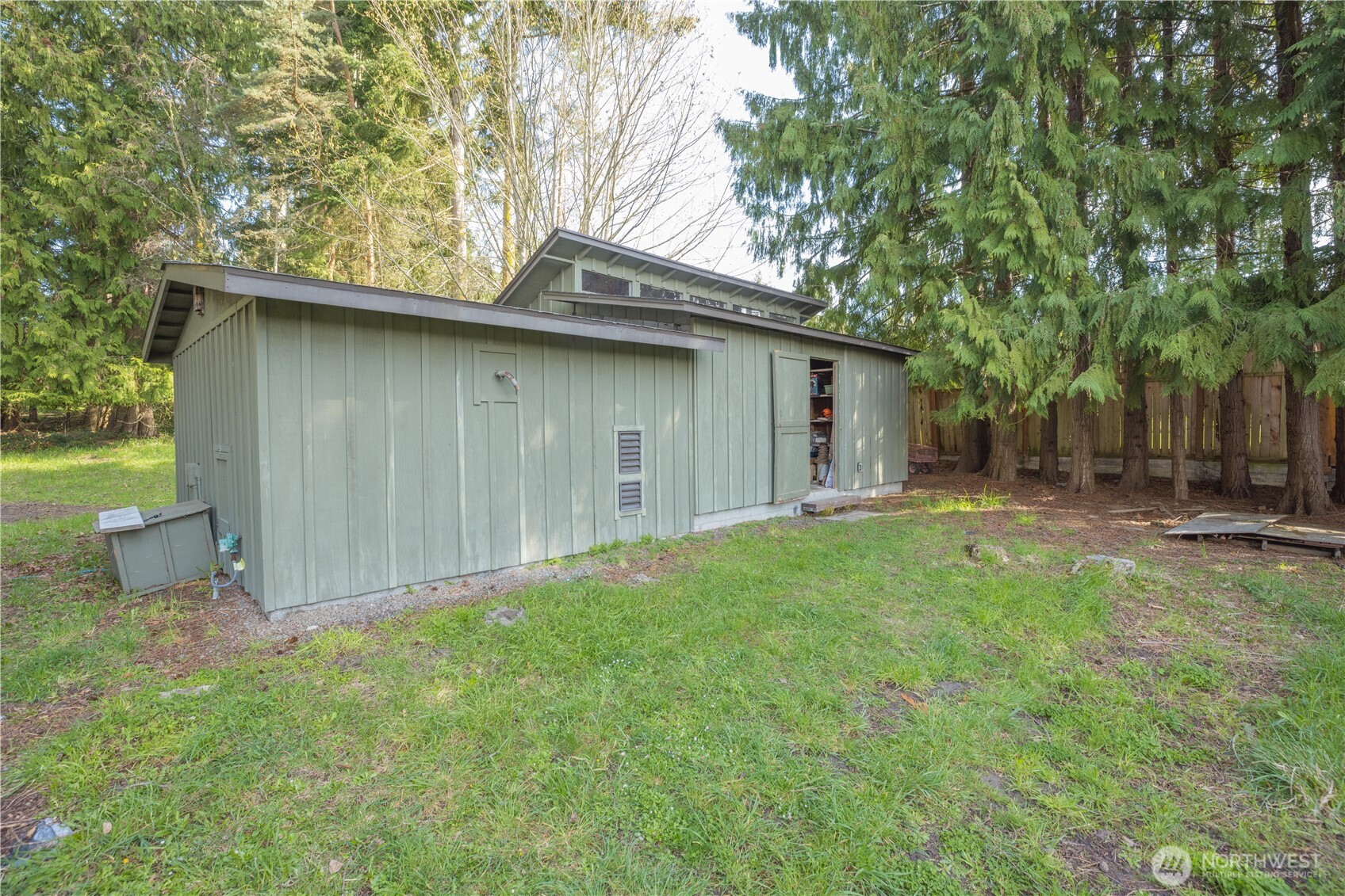 254 Simpson Road Sequim, WA 98382 - Photo 27 of 40 a backyard of a house with lots of green space