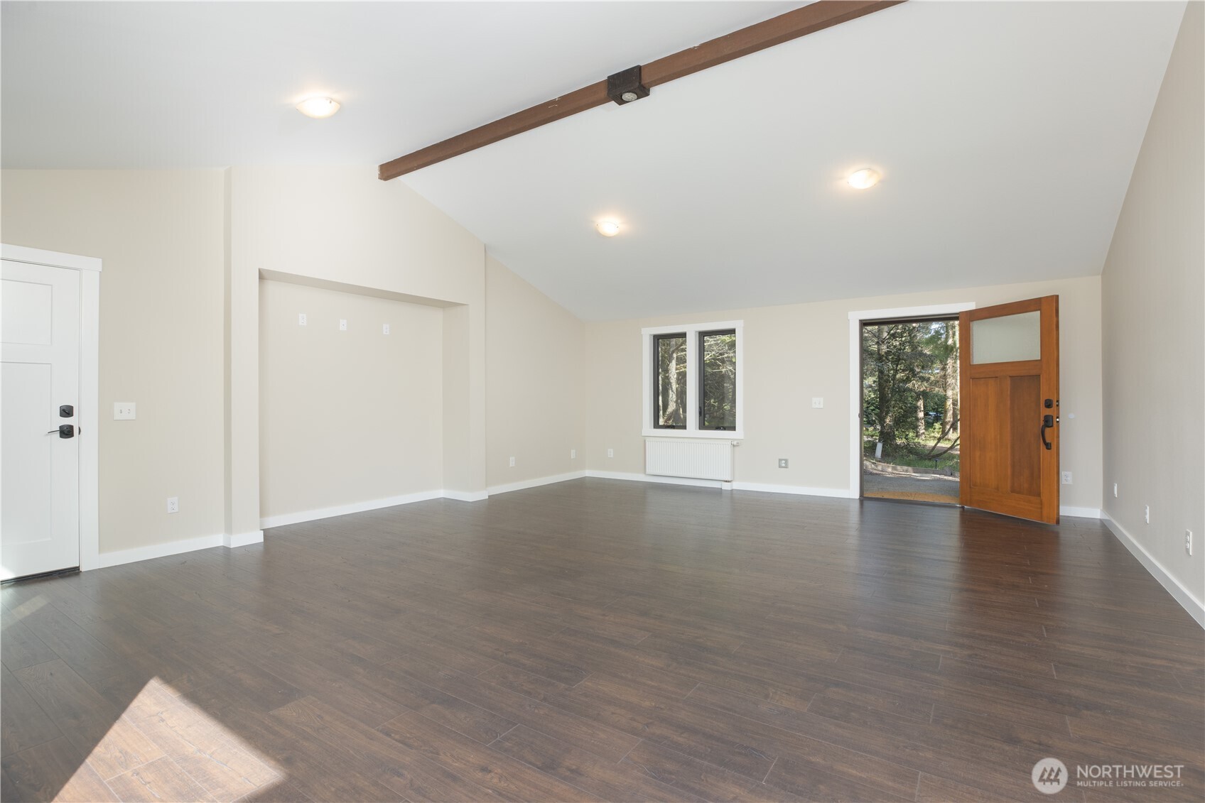 254 Simpson Road Sequim, WA 98382 - Photo 5 of 40 a view of an empty room with wooden floor and windows