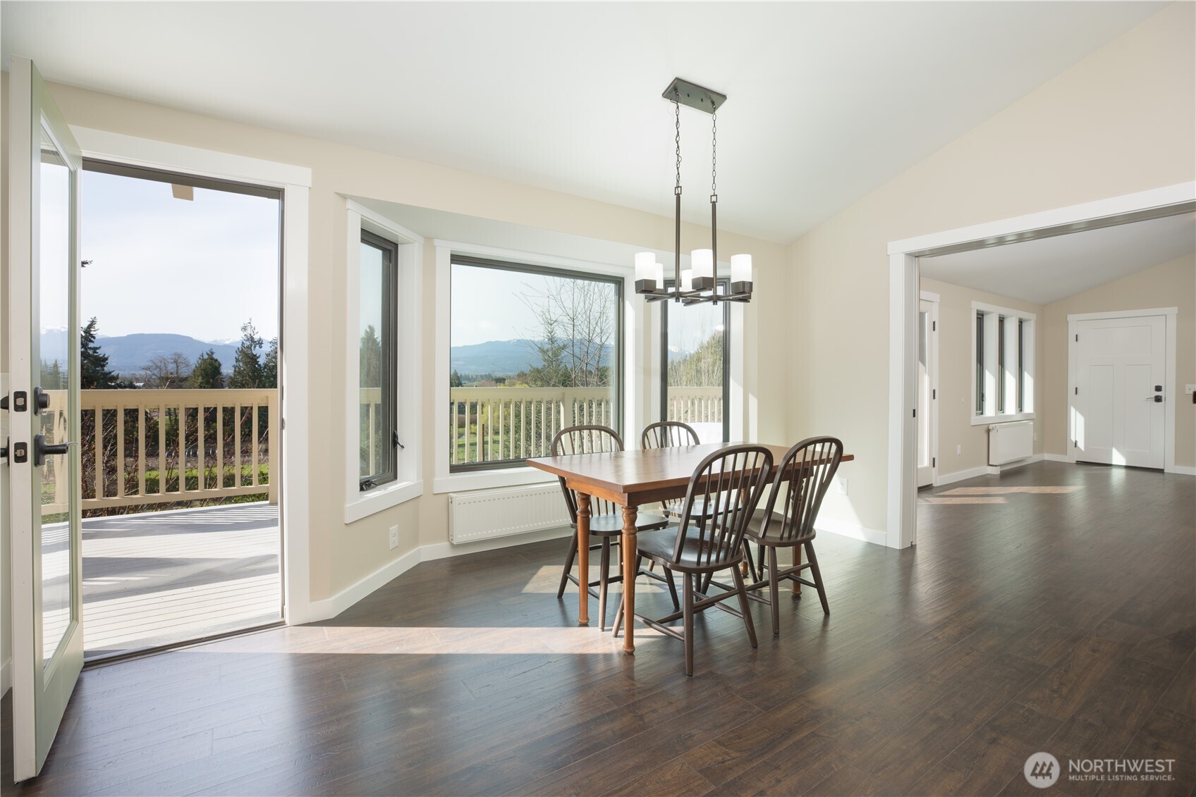 254 Simpson Road Sequim, WA 98382 - Photo 6 of 40 a view of a dining room with furniture window and wooden floor