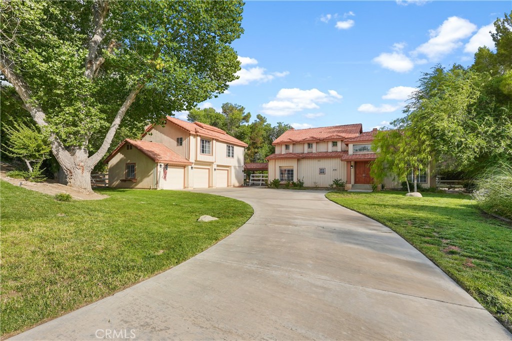 a view of house with yard