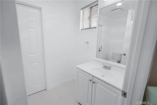 a bathroom with a sink a vanity and a mirror