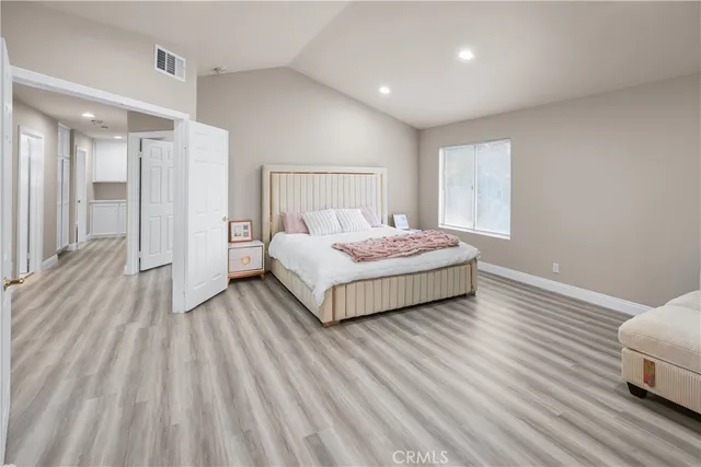 a bedroom with a bed and a table