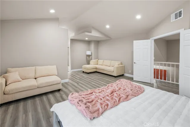 a bedroom with furniture and a couch