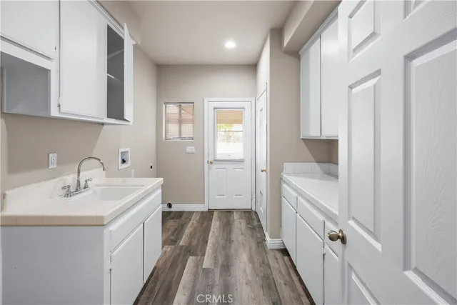 a bathroom with a sink a mirror and a bathtub