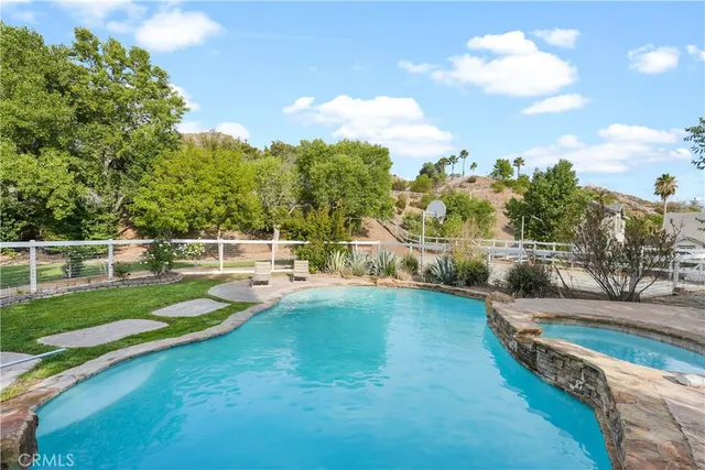a view of a swimming pool with a lake view