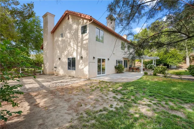 a view of a house with a yard and garage