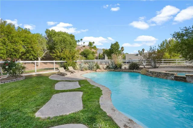 a view of a swimming pool with a patio
