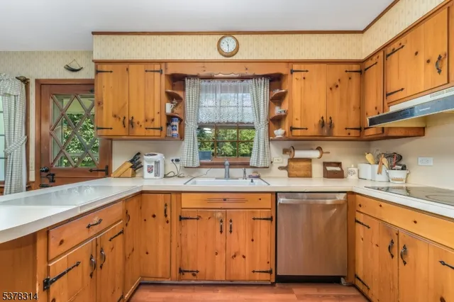 a dining area with a table and chairs
