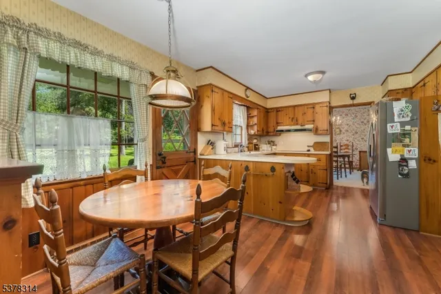 a view of a dining room with furniture window and outside view
