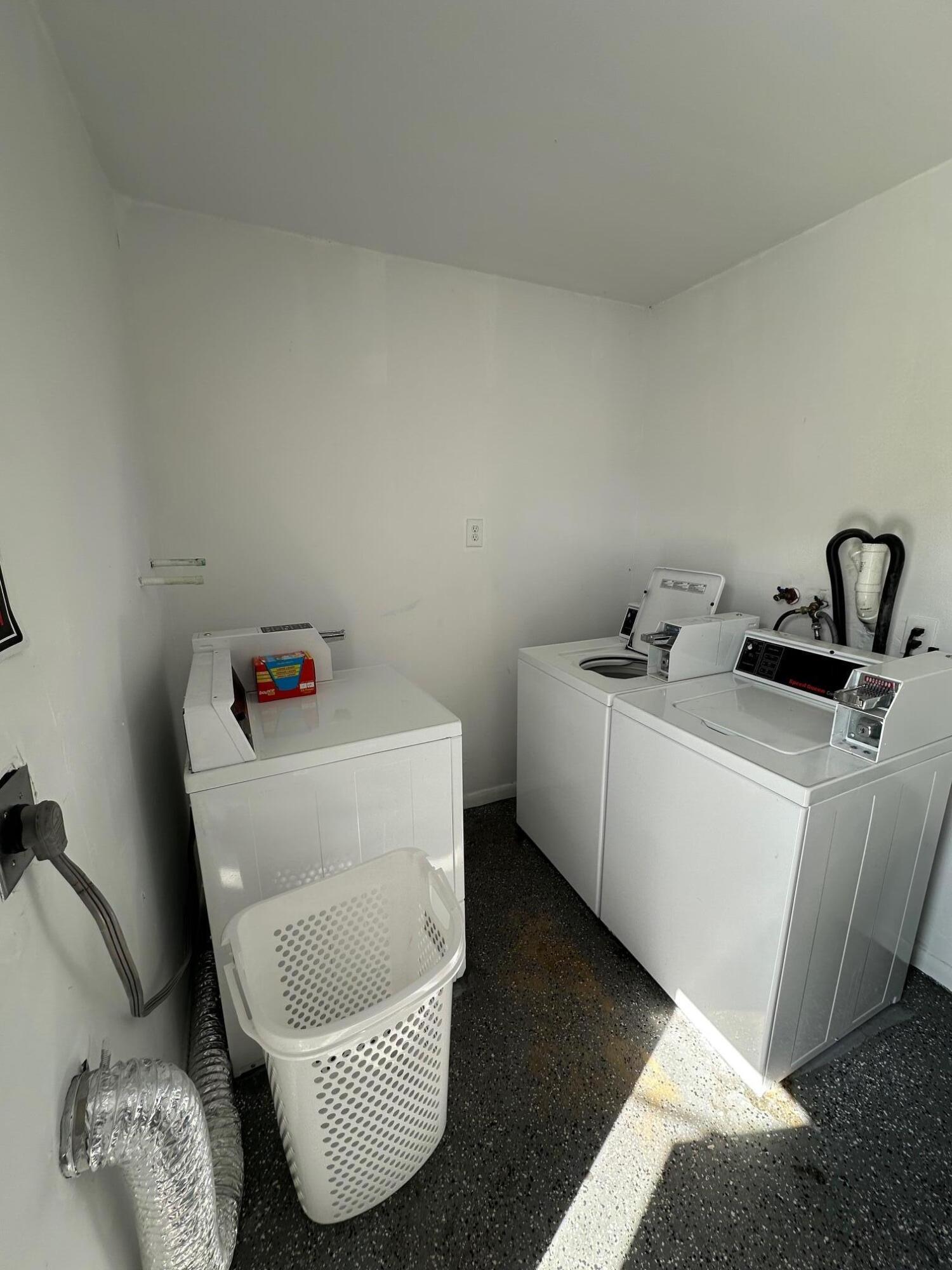 4810 Davis Road, Unit 4814 Lake Worth, FL 33461 - Photo 14 of 14 a room with a baby crib and a couch