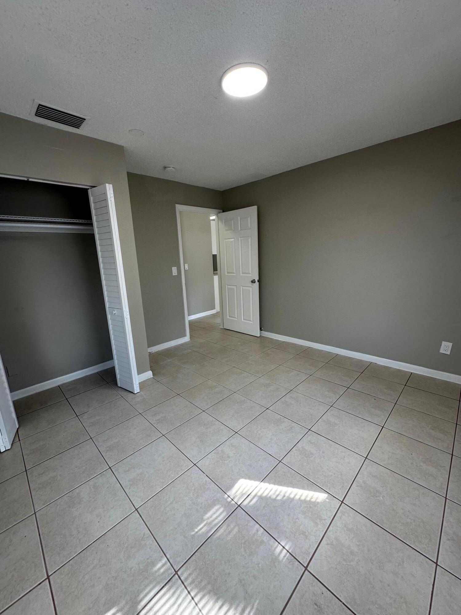 4810 Davis Road, Unit 4814 Lake Worth, FL 33461 - Photo 8 of 14 a view of an empty room