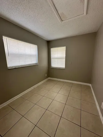 a view of an empty room with a window