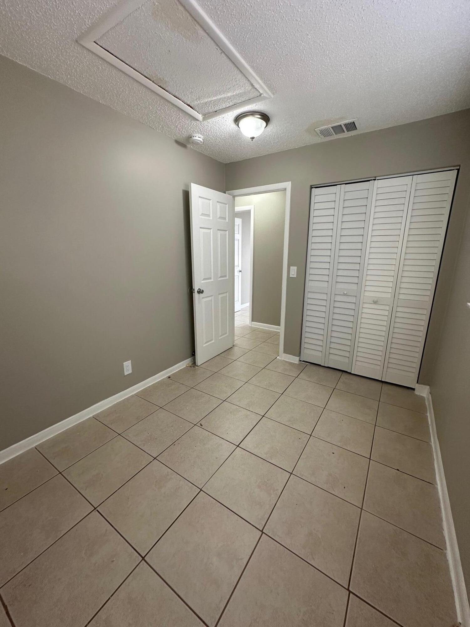 4810 Davis Road, Unit 4814 Lake Worth, FL 33461 - Photo 10 of 14 a view of a garage