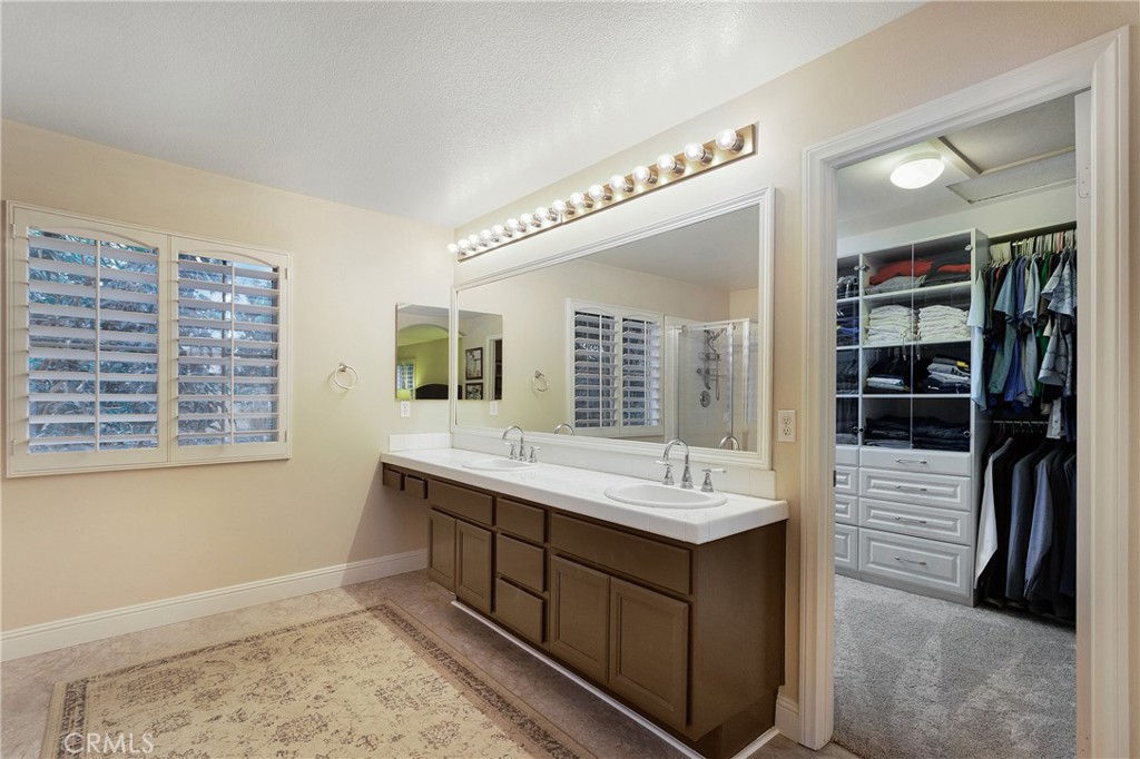 28 Rosenblum Irvine, CA 92602 - Photo 23 of 25 a bathroom with a sink and a mirror