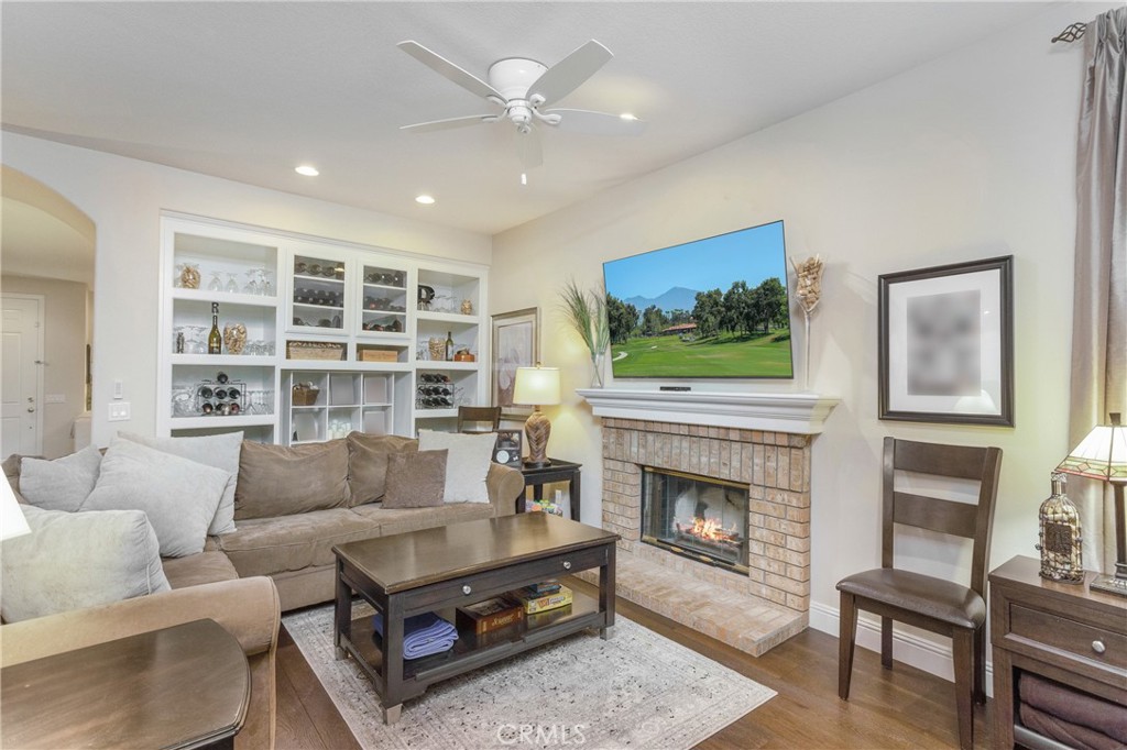 28 Rosenblum Irvine, CA 92602 - Photo 4 of 25 a living room with furniture and a fireplace