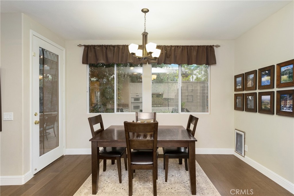 28 Rosenblum Irvine, CA 92602 - Photo 10 of 25 a view of a dining room with furniture window and wooden floor