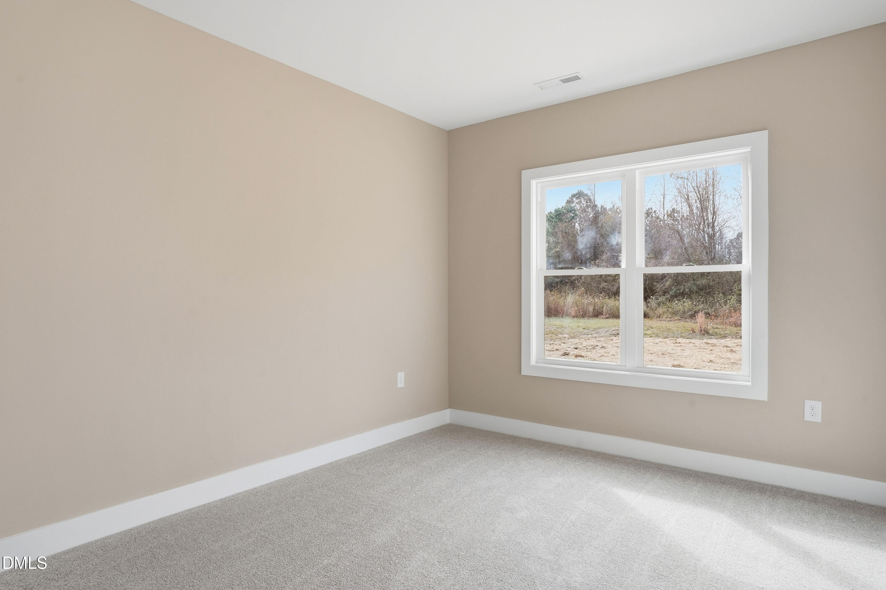 1115 Jada Allen Road Dunn, NC 28334 - Photo 16 of 32 an empty room with a window