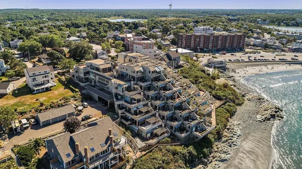 an aerial view of a house with a yard