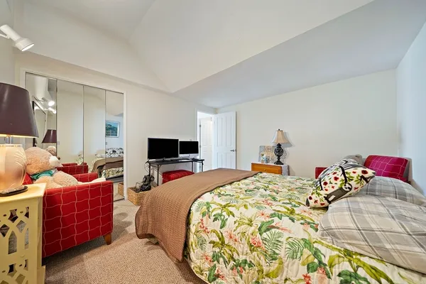 a bed room with a bed and a tv