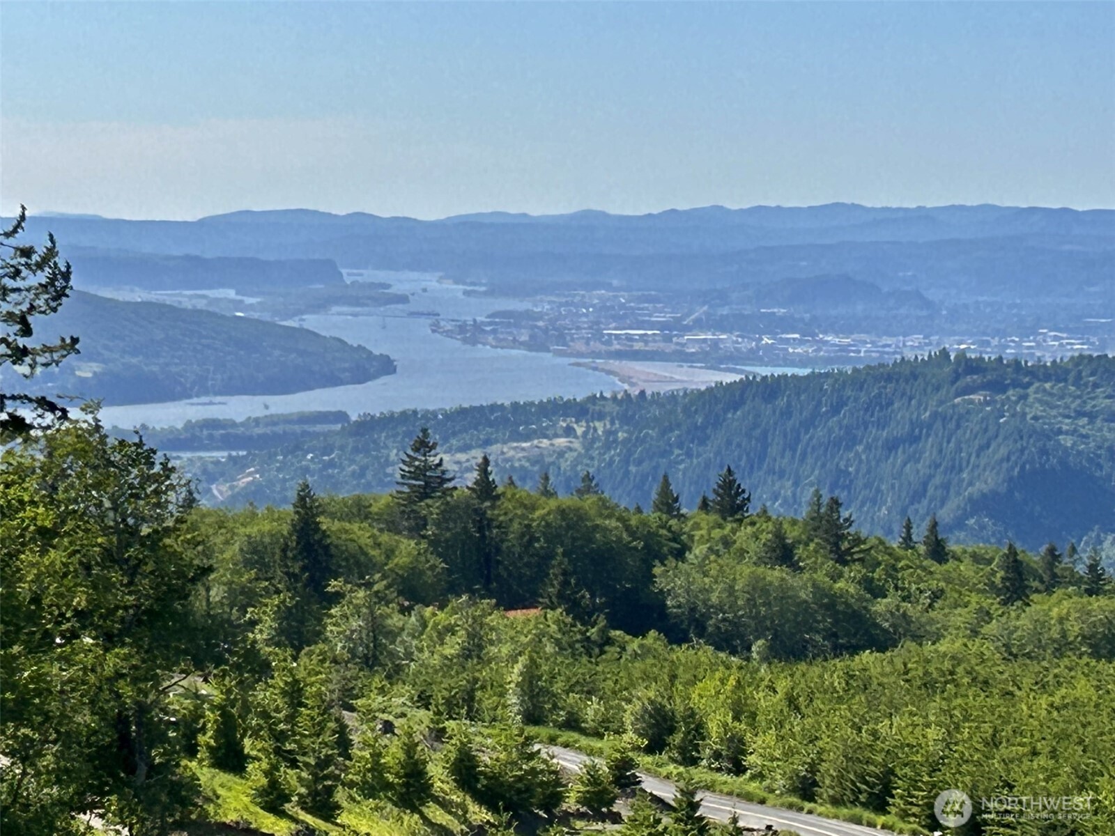 an aerial view of mountain with yard