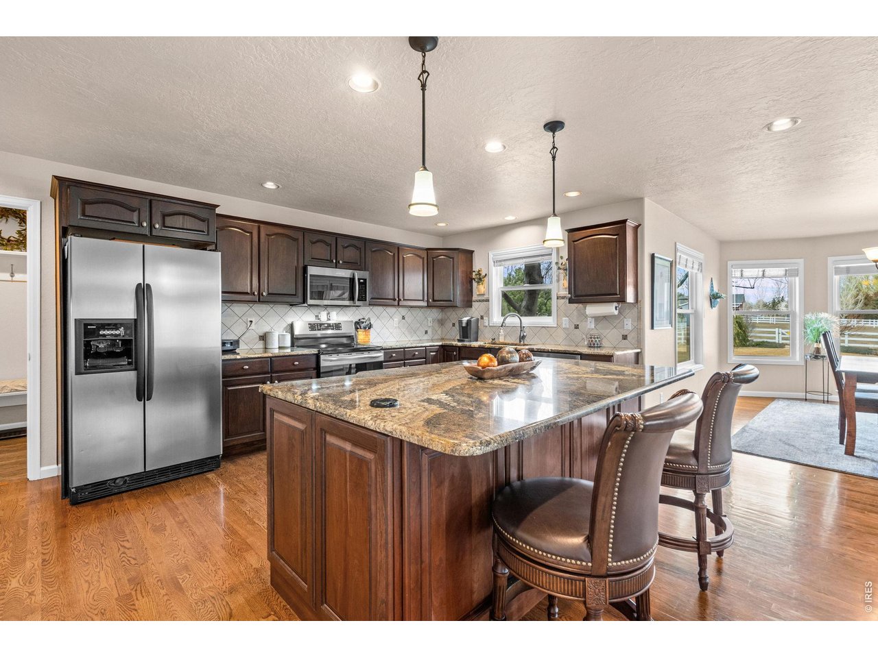 6345 Lesser Drive Greeley, CO 80634 - Photo 18 of 47 Spacious island kitchen with bar seating