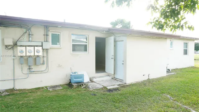 a view of backyard of a house