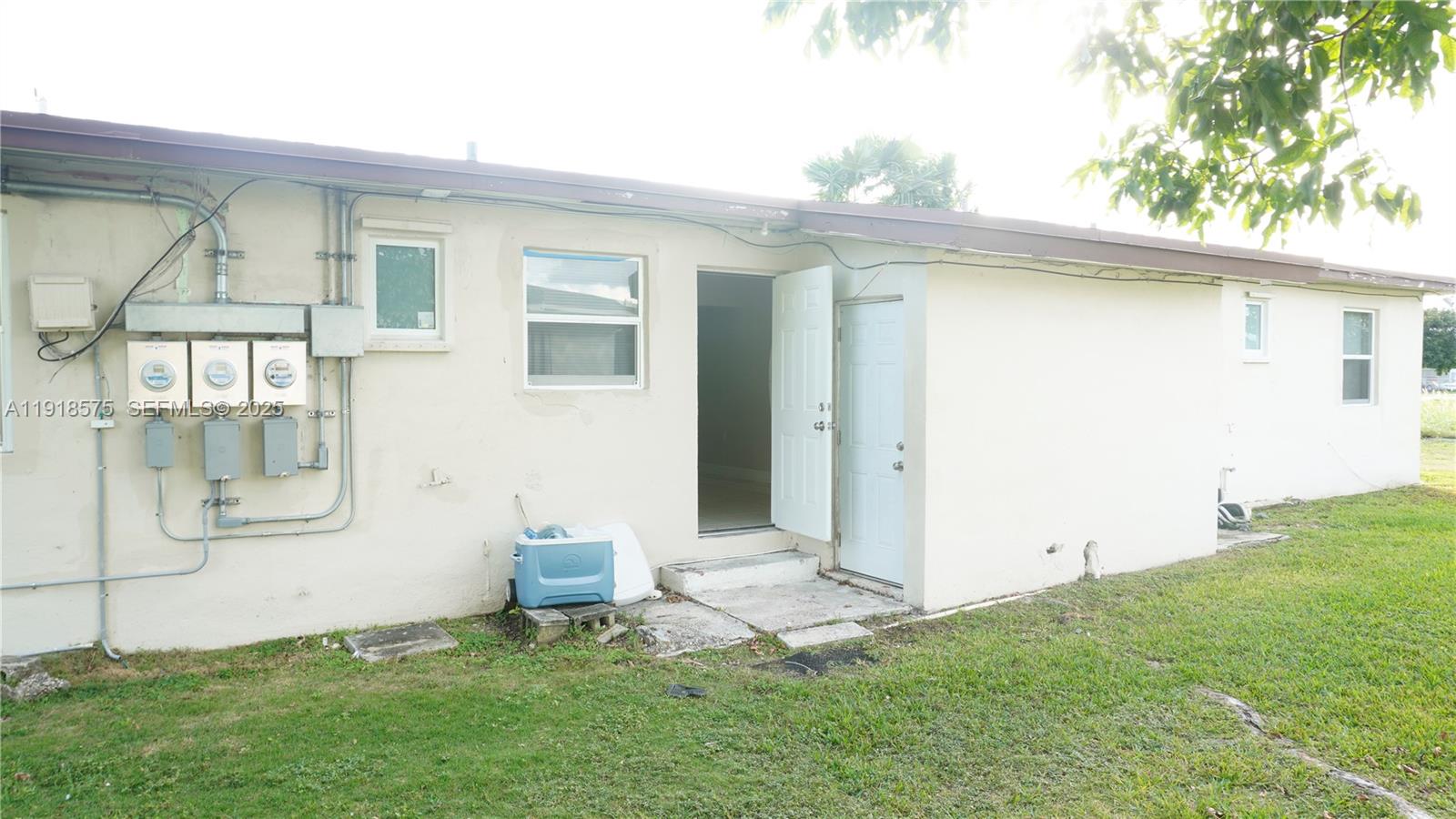 13701 Southwest 266th Street, Unit 13701 Homestead, FL 33032 - Photo 9 of 10 a view of backyard of a house