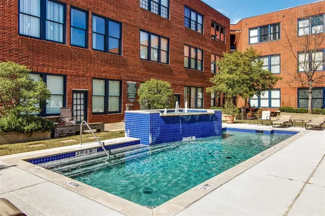 a front view of building with street