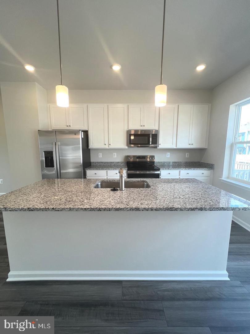 342 Watercourse Drive Ranson, WV 25438 - Photo 8 of 17 Modern kitchen with sleek finishes.