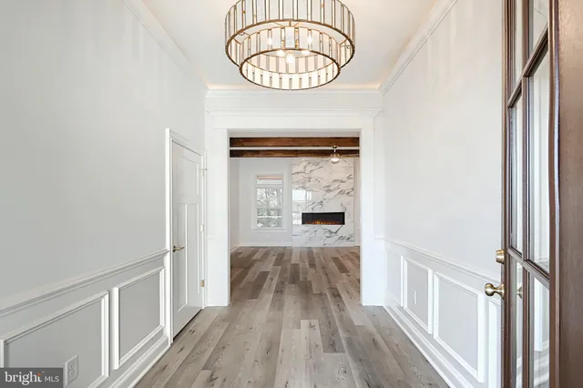 a view of hallway with wooden floor