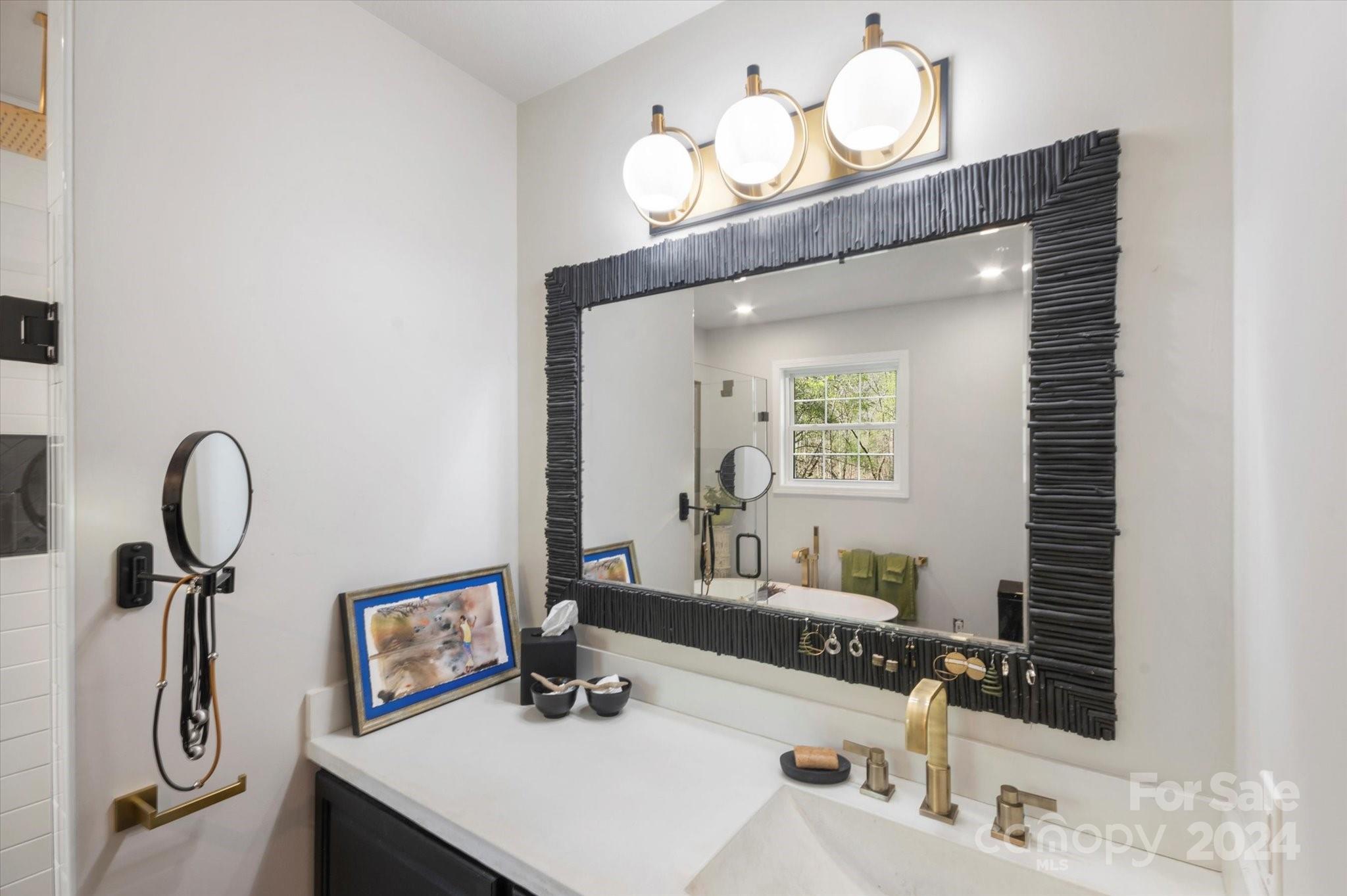 16 Leisure Loop Weaverville, NC 28787 - Photo 15 of 44 a bathroom with a sink and a mirror