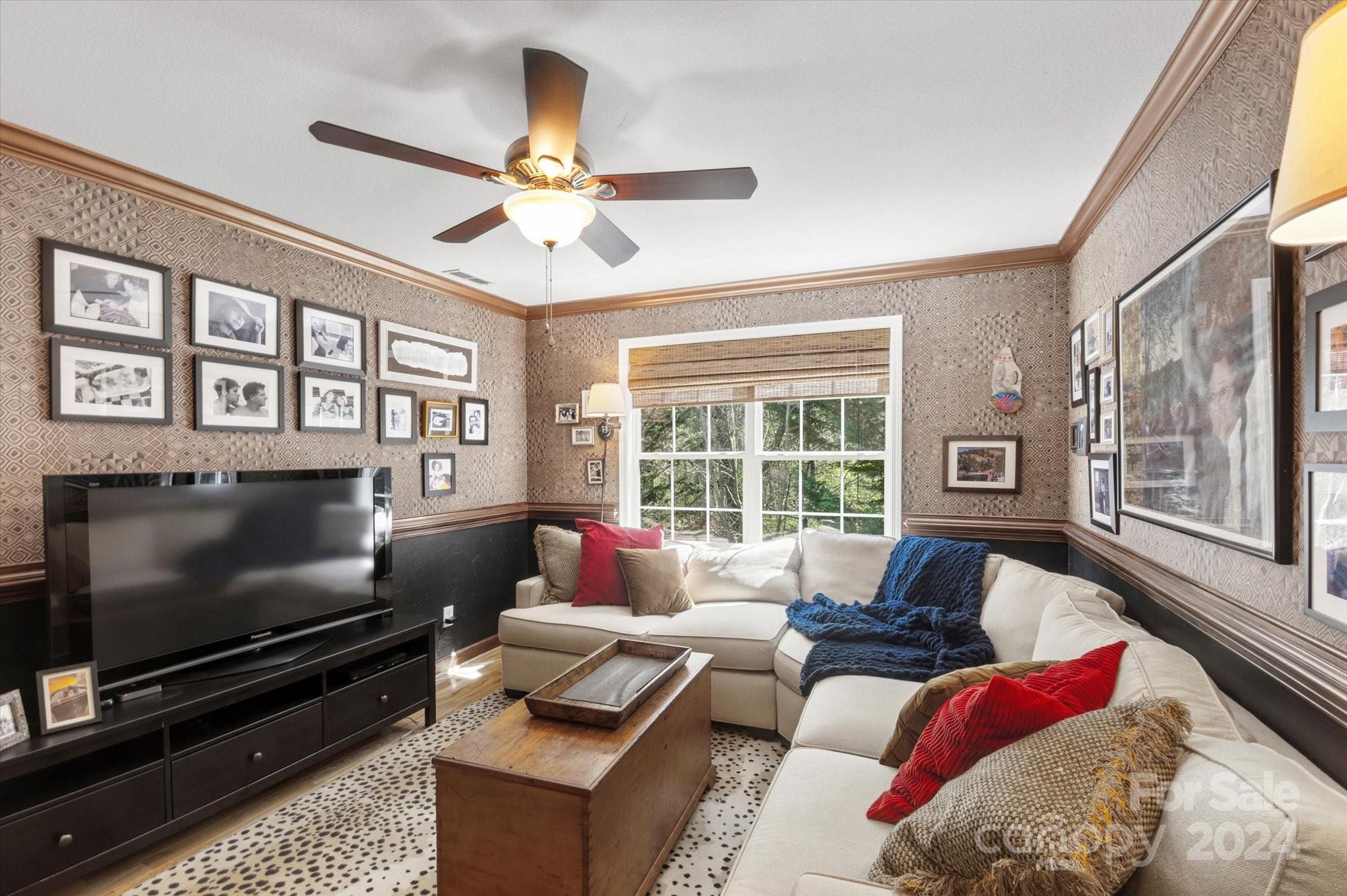 16 Leisure Loop Weaverville, NC 28787 - Photo 24 of 44 a living room with furniture tv and a fireplace