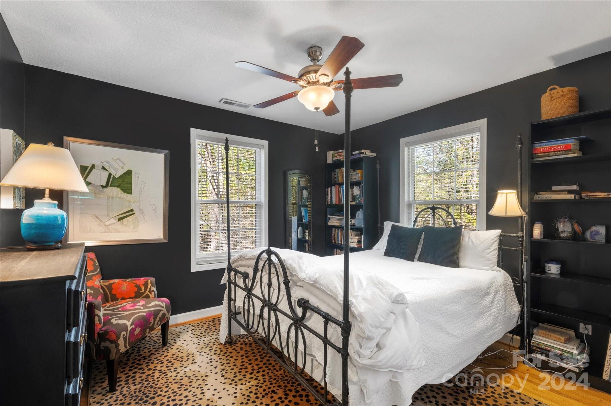 16 Leisure Loop Weaverville, NC 28787 - Photo 27 of 44 a bedroom with a bed a large window with table and chairs