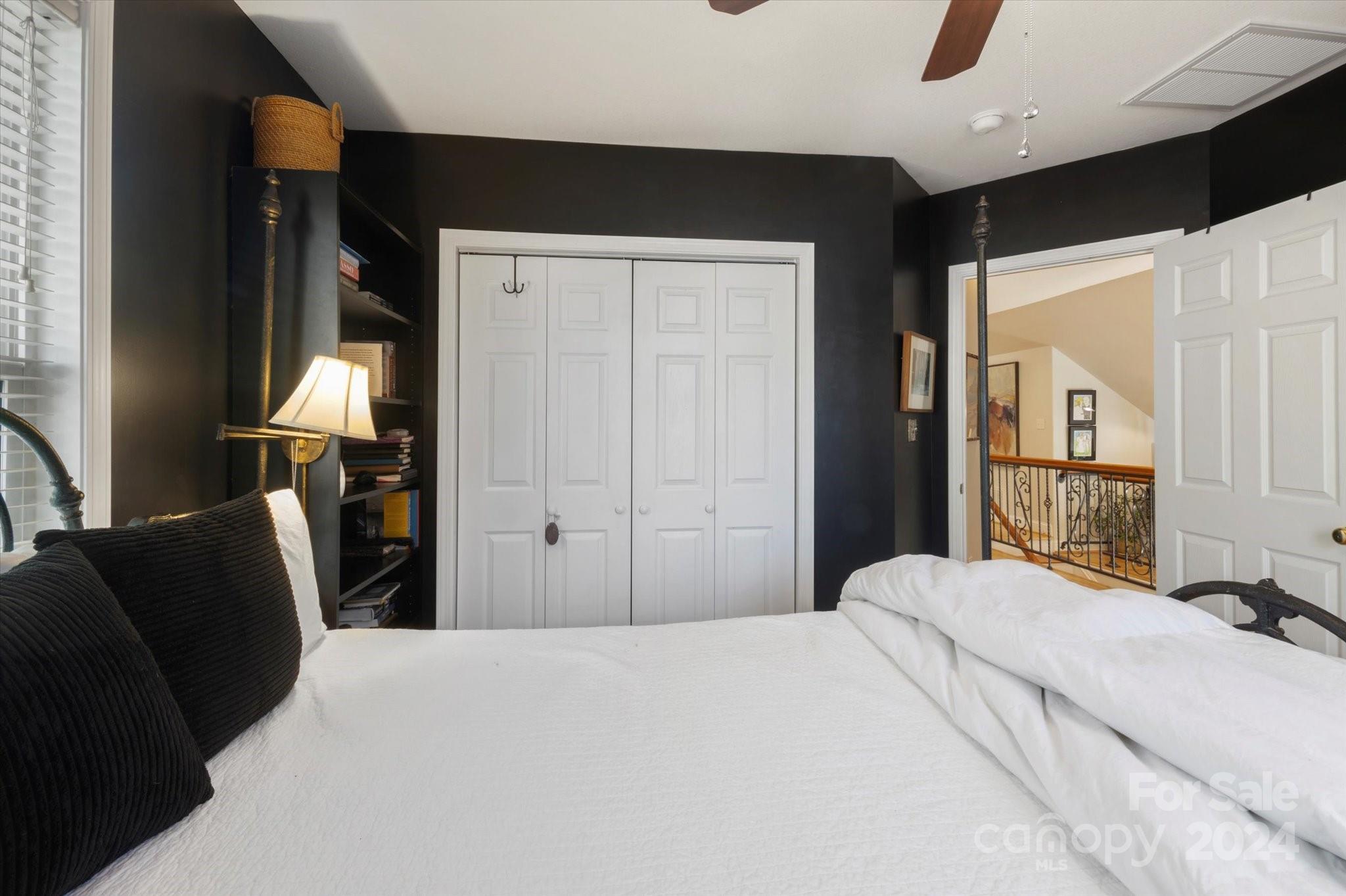 16 Leisure Loop Weaverville, NC 28787 - Photo 28 of 44 a bedroom with a bed and a mirror