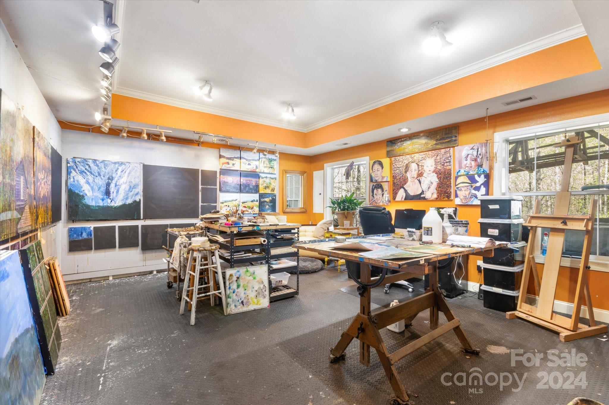 16 Leisure Loop Weaverville, NC 28787 - Photo 36 of 44 a room with lots of tables a large window and chairs