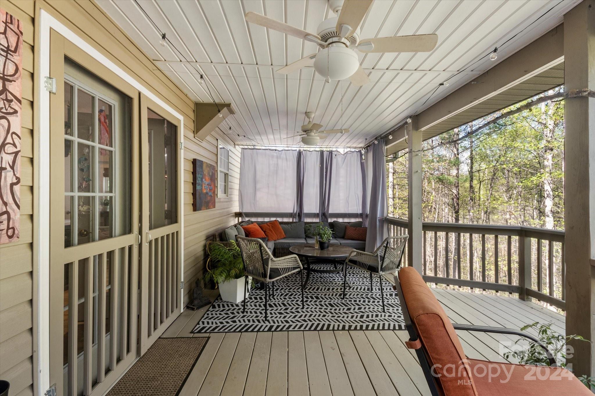 16 Leisure Loop Weaverville, NC 28787 - Photo 39 of 44 a view of balcony with couch and wooden floor