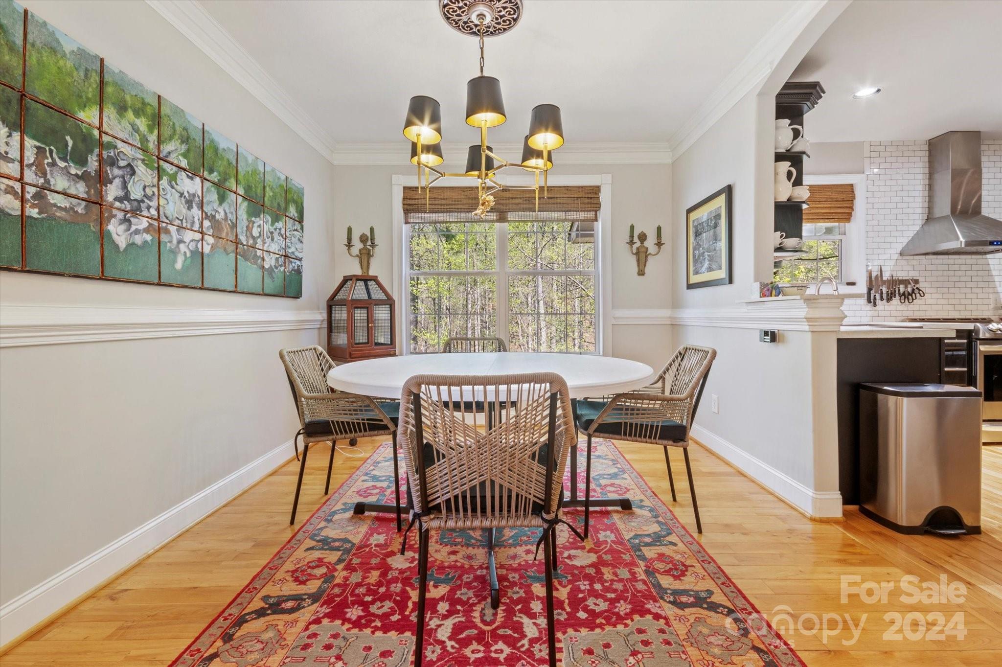 16 Leisure Loop Weaverville, NC 28787 - Photo 6 of 44 a dining room with furniture a rug and wooden floor