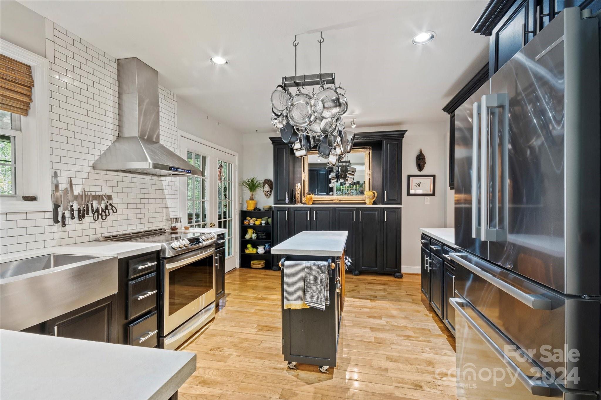 16 Leisure Loop Weaverville, NC 28787 - Photo 7 of 44 a kitchen with stainless steel appliances granite countertop a sink stove and refrigerator