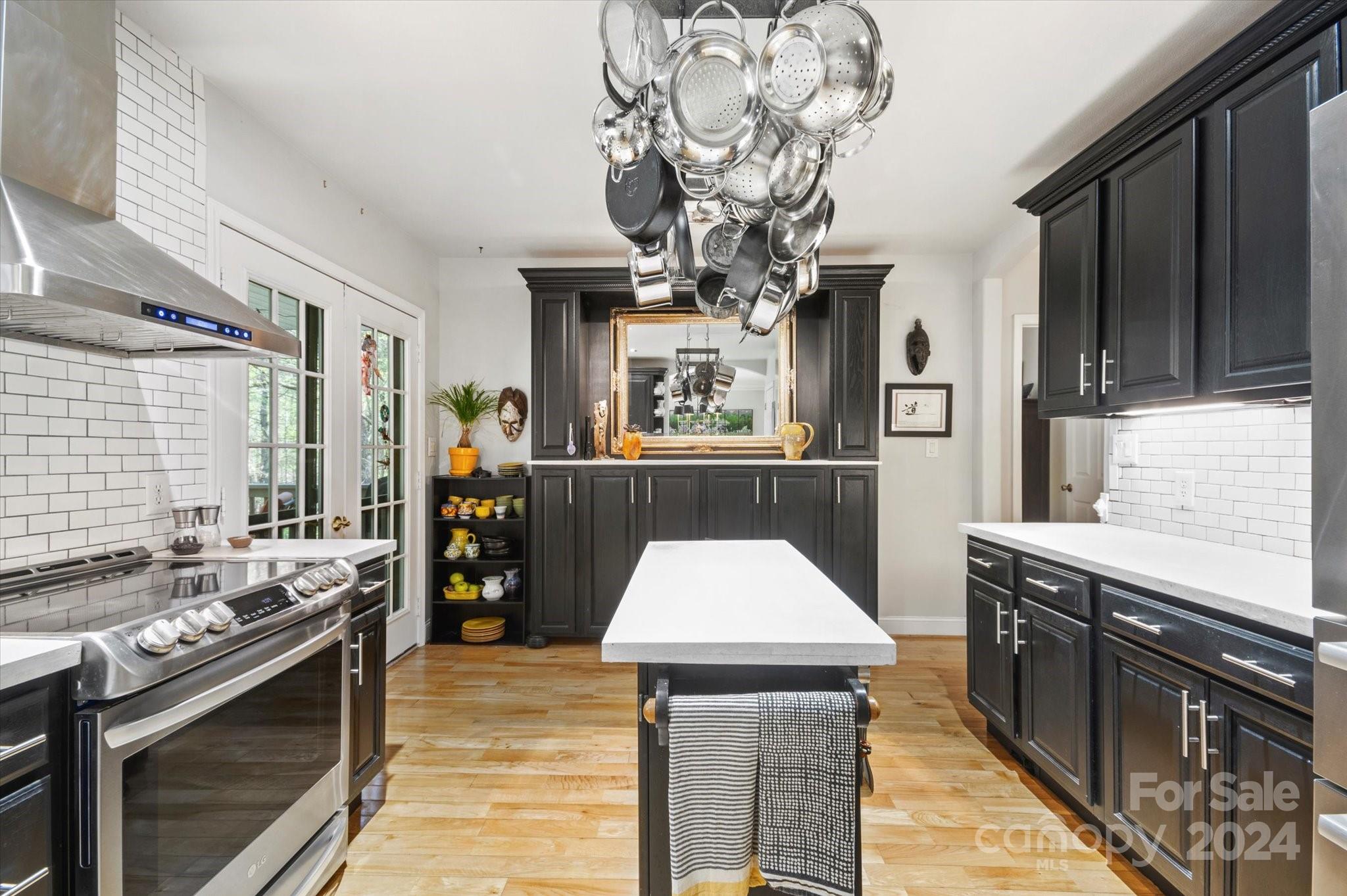 16 Leisure Loop Weaverville, NC 28787 - Photo 8 of 44 a kitchen with stainless steel appliances granite countertop a sink stove and refrigerator