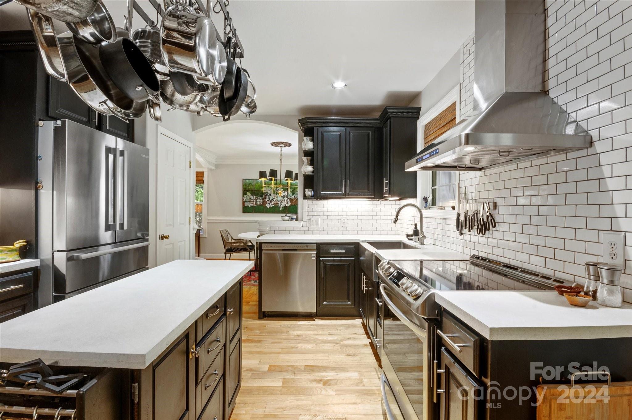 16 Leisure Loop Weaverville, NC 28787 - Photo 9 of 44 a kitchen with stainless steel appliances a sink a stove and refrigerator