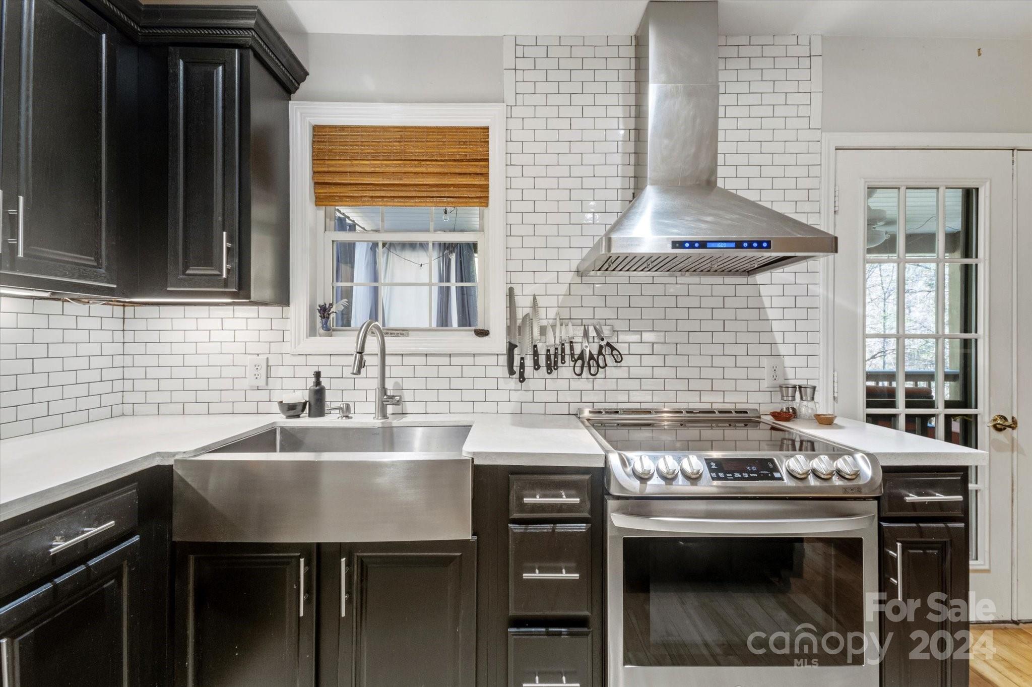 16 Leisure Loop Weaverville, NC 28787 - Photo 10 of 44 a kitchen with a stove and a sink