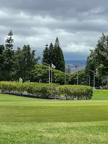 a view of a lake in front of house with a yard