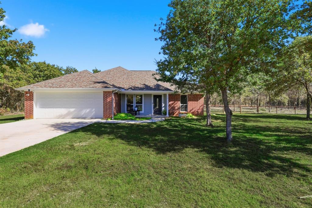 138 Gobbler Road Nocona, TX 76255 - Photo 11 of 35 a front view of a house with a yard