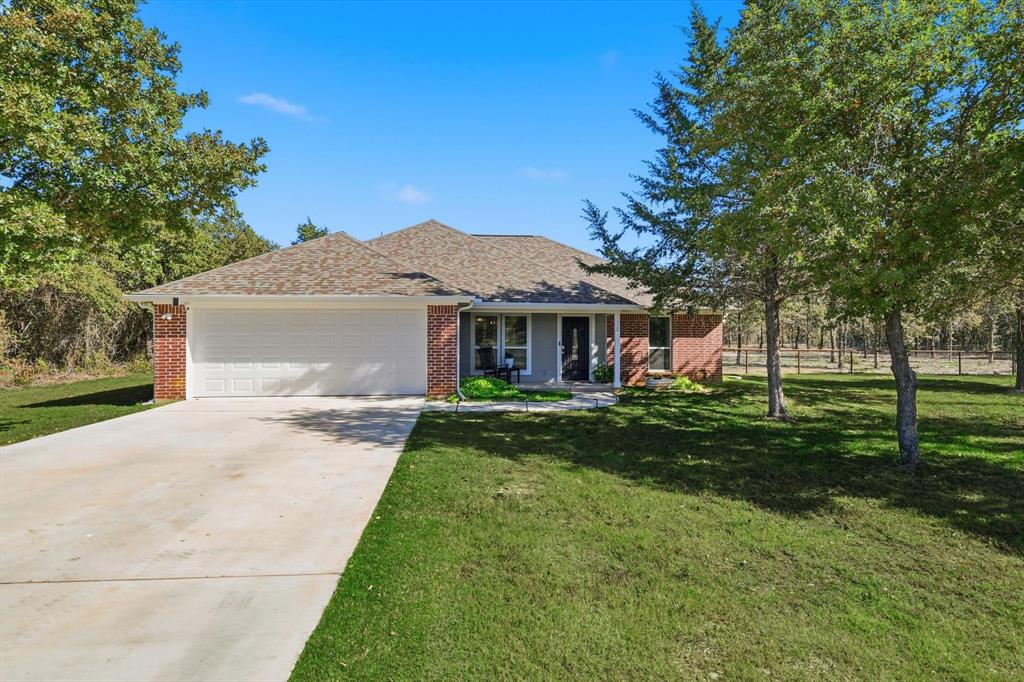138 Gobbler Road Nocona, TX 76255 - Photo 12 of 35 a front view of a house with a yard