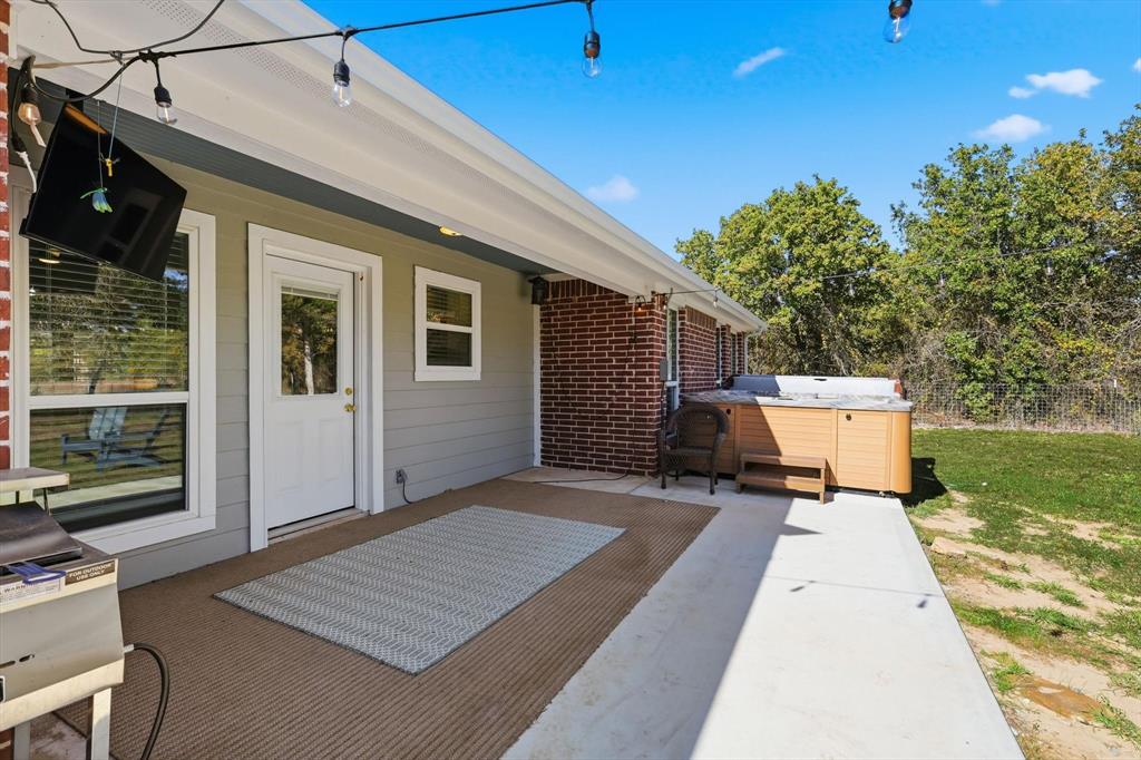 138 Gobbler Road Nocona, TX 76255 - Photo 25 of 35 a patio with table and chairs and potted plants
